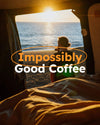 Van life morning routine by the beach with ocean view, person drinking coffee at sunrise, relaxed camping lifestyle, "Impossibly Good Coffee" text overlay.