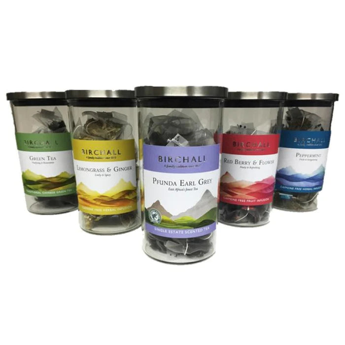 Assorted Birchall tea selection in glass jars, featuring Green Tea, Lemongrass & Ginger, Pfunda Earl Grey, Red Berry & Flower, and Peppermint, premium herbal and flavored teas.